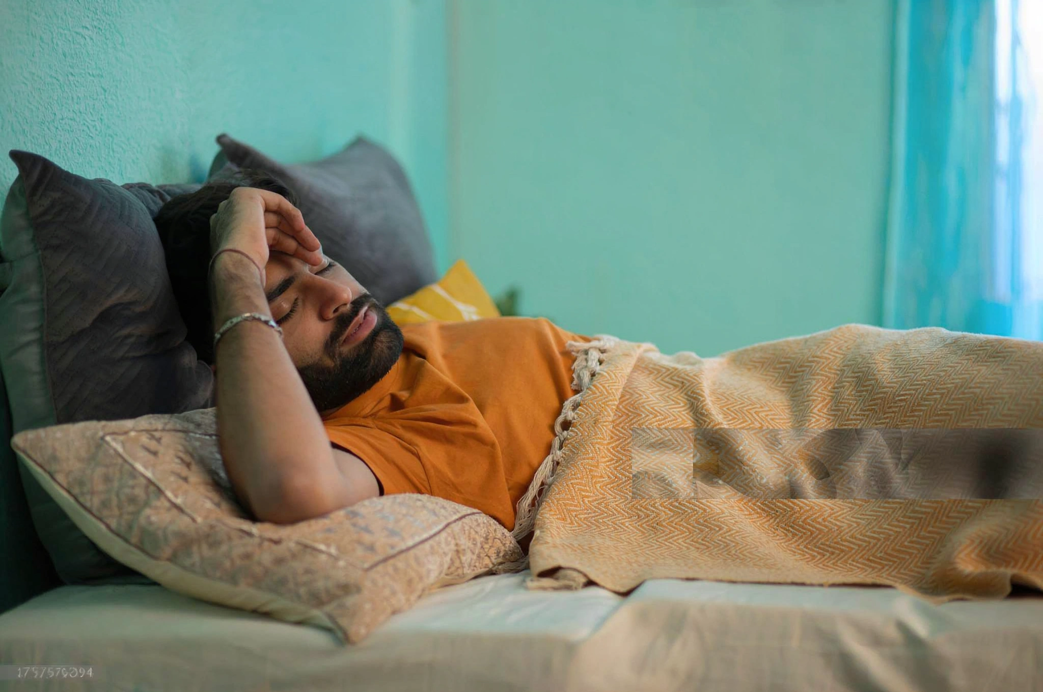 Man resting comfortably on a bed during a power cut.