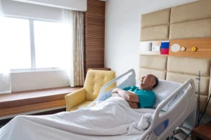 Patient using a hospital bed for back pain recovery