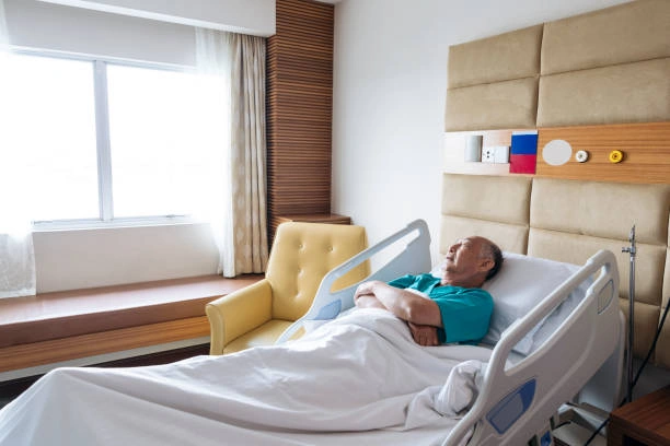 Patient using a hospital bed for back pain recovery